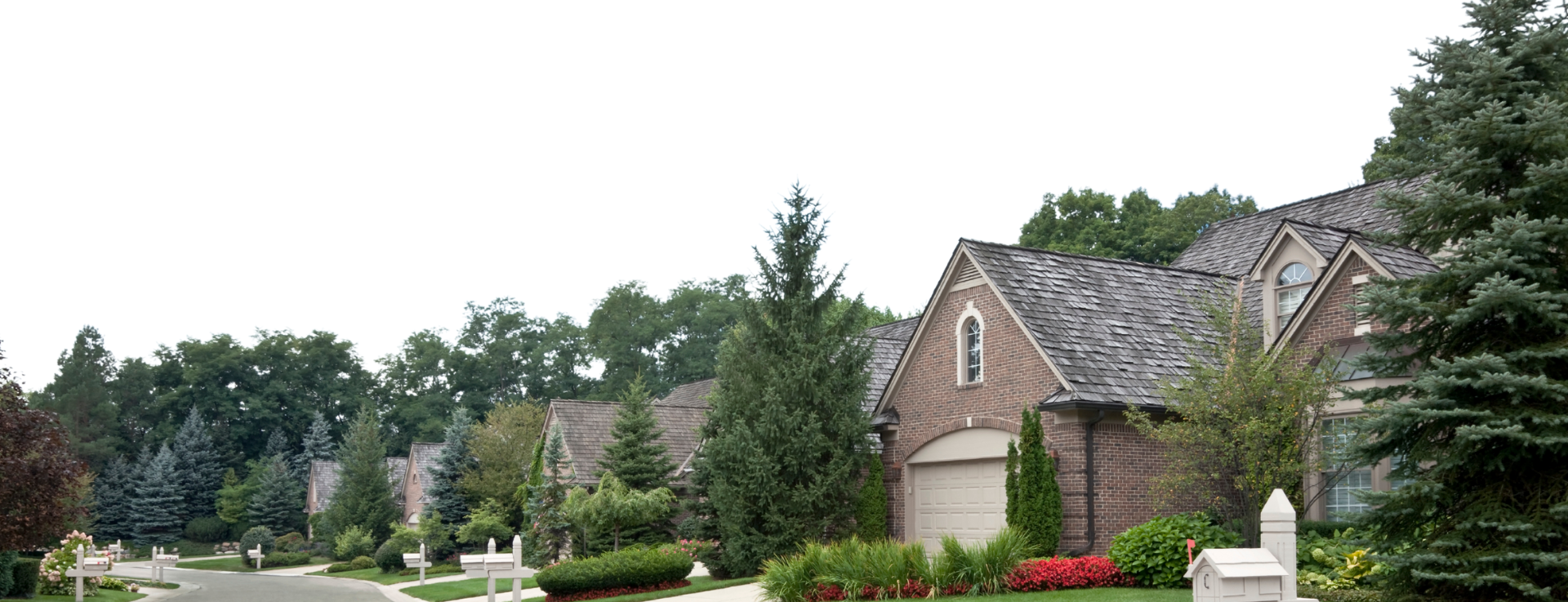 row of brick houses in suburban neighborhood