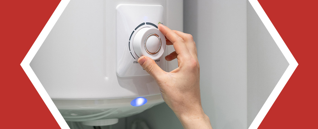 person adjusting a water heater