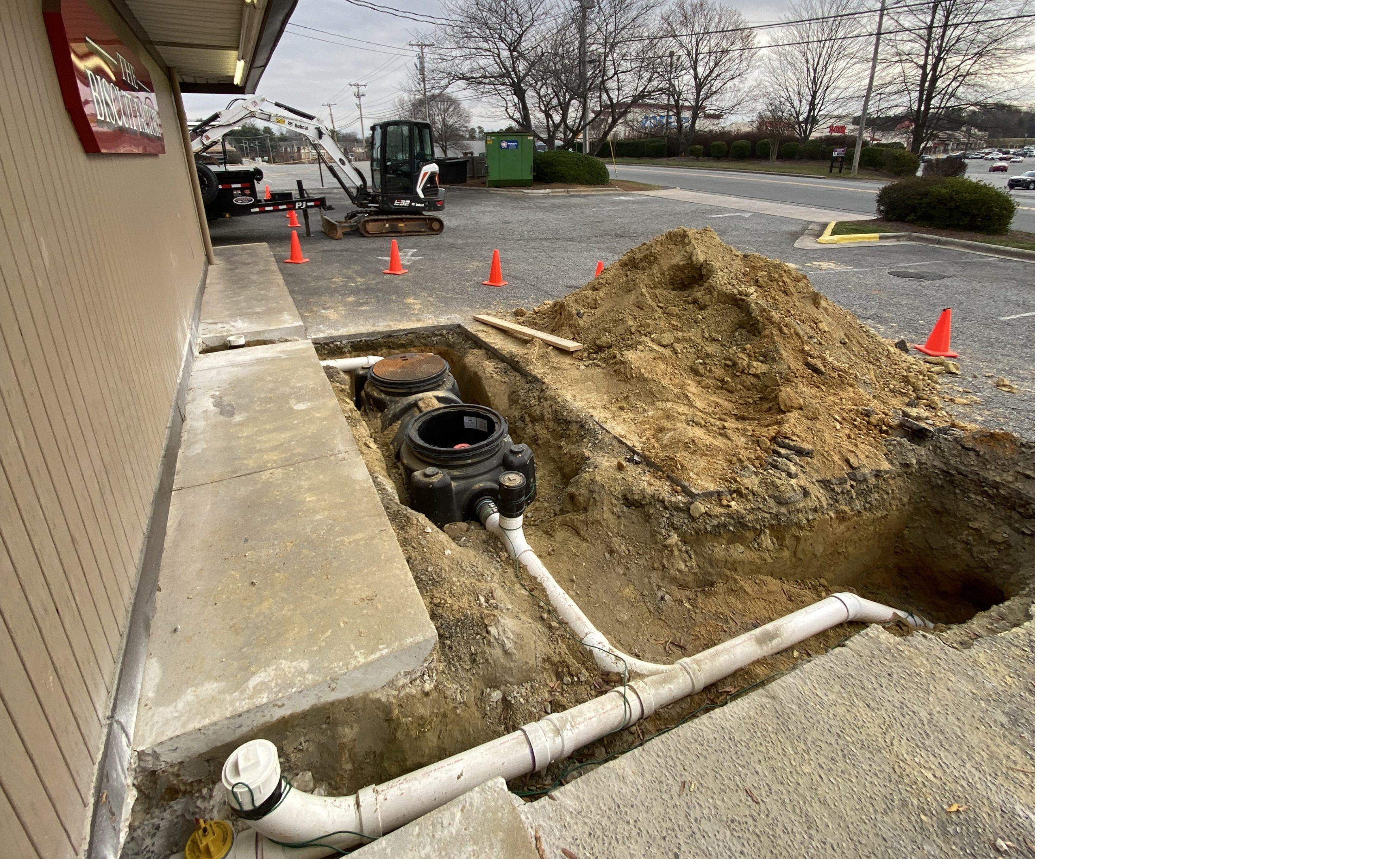 piping work being down outside commercial building