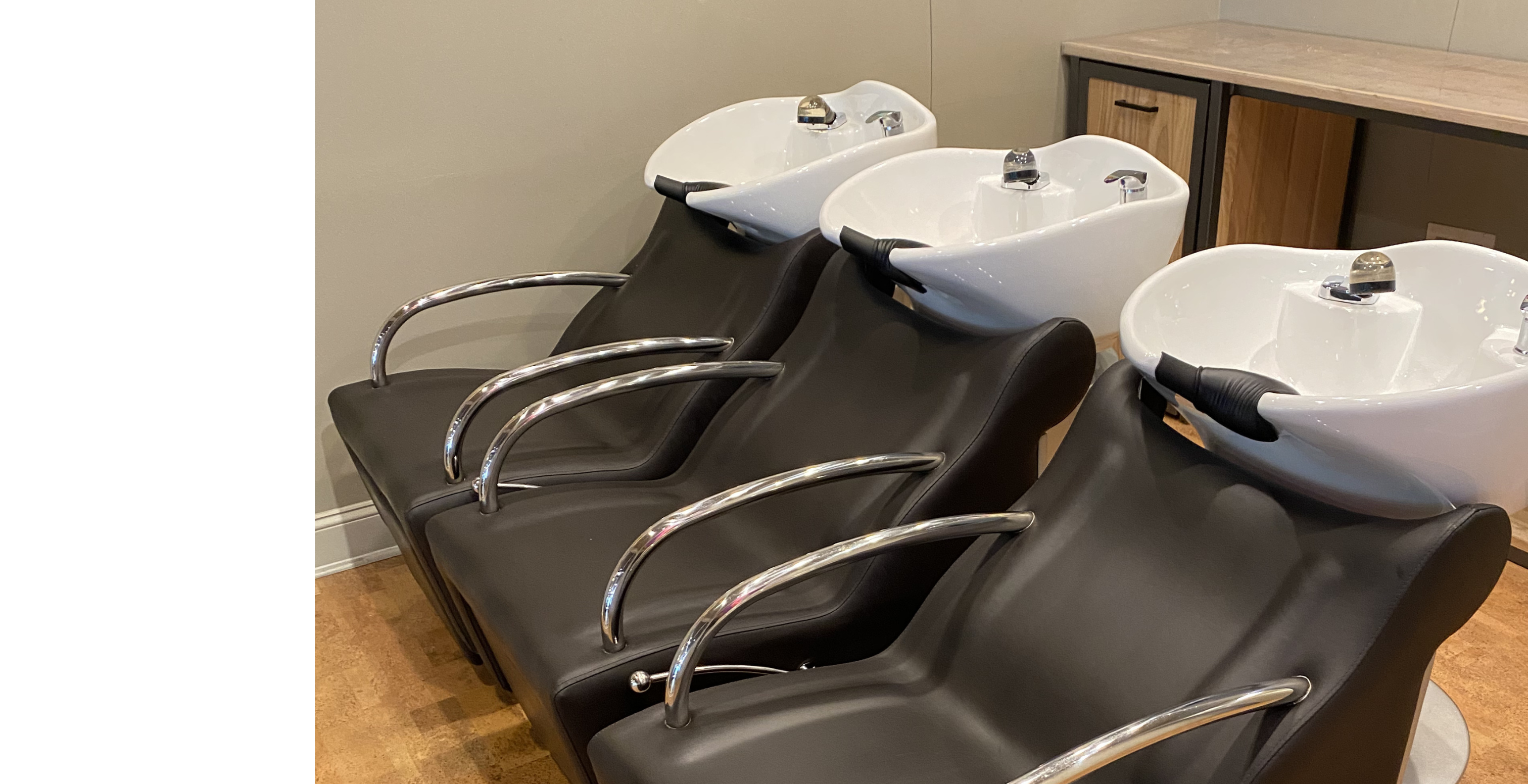 three shampoo stations in a salon